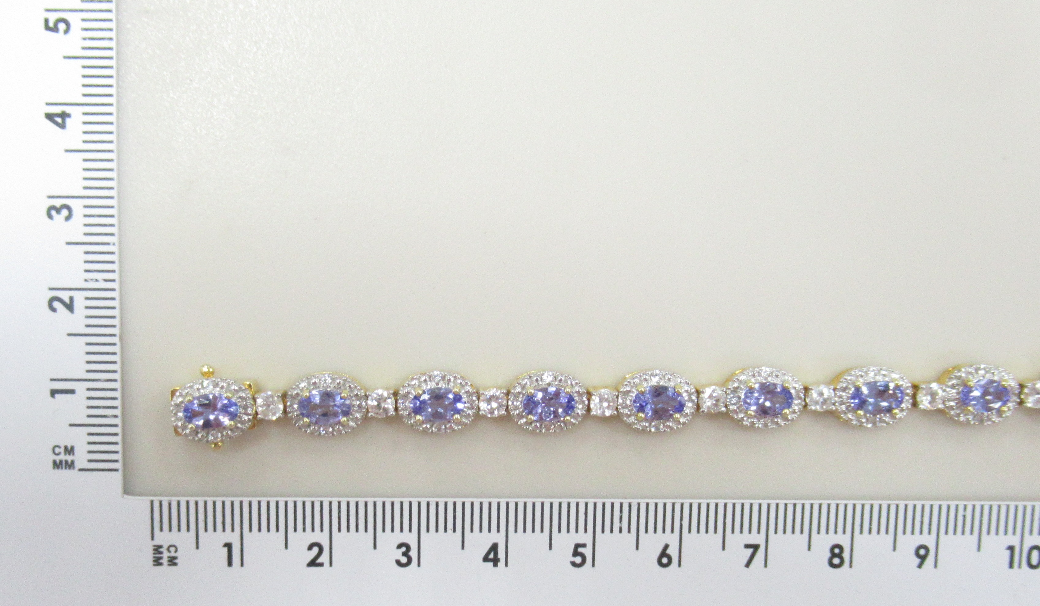 Серебряный браслет 925 пробы; вставки 15 Танзанит 6,13ct; 75 Циркон бесцв. 3,39ct;